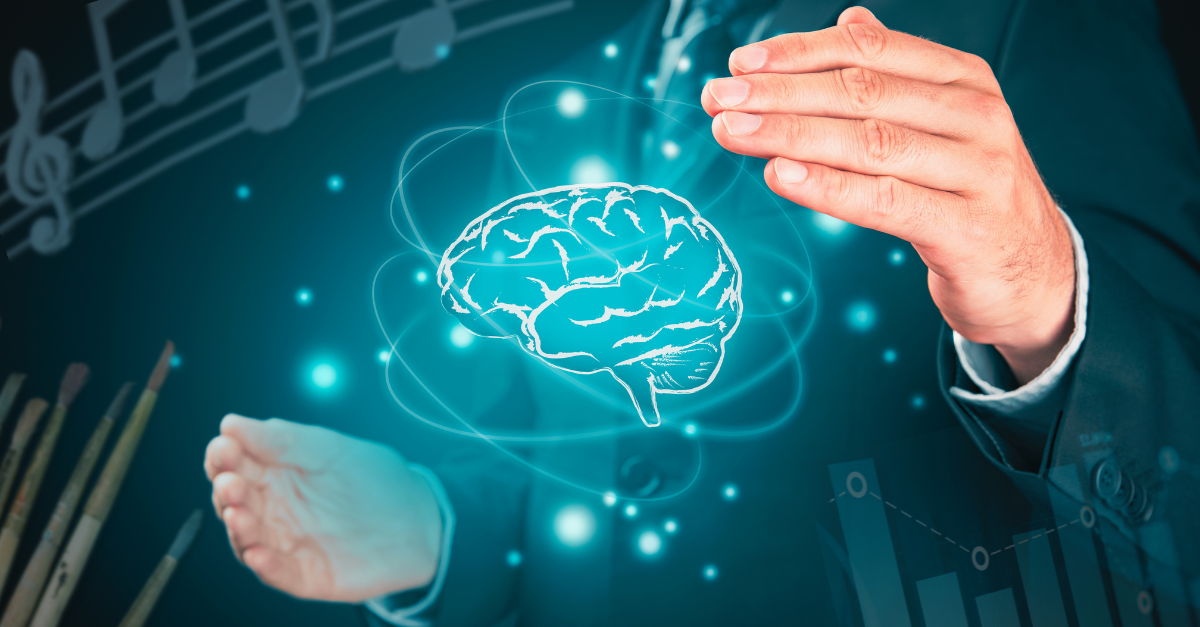 Man holding an image of a brain between his hands. Music notes, paintbrushes and bar graphs are floating around the corners.