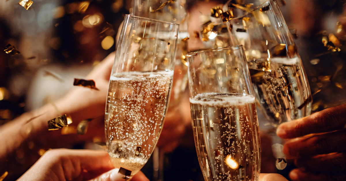 people celebrating with champagne flutes