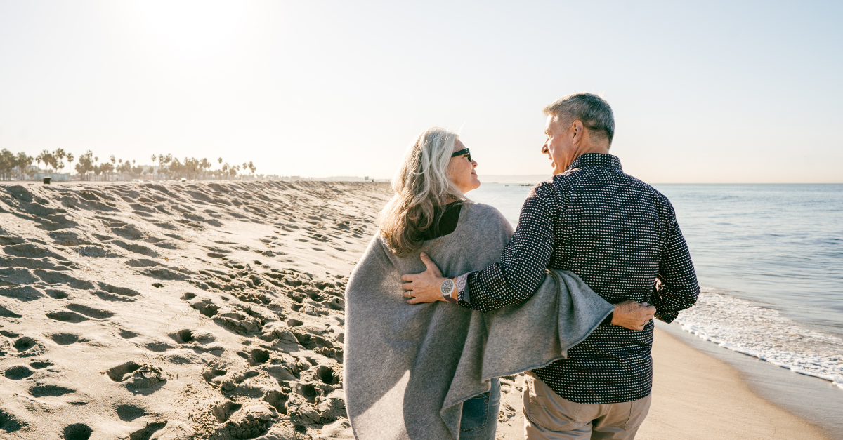 A couple walking on the beach